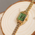 Green Surface Gold Strap